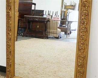 1147	WALL MIRROR IN ORNATE GILT FINISHED FRAME, APPROXIMATELY 36 IN X 48 IN
