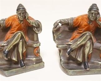 1210	METAL BOOKENDS OF A MAN SITTING, APPROXIMATELY 6 1/2 IN H
