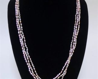 1267	THREE STRAND CULTURED FRESHWATER PEARL NECKLACE.
