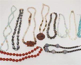 1291	LOT OF 9 NECKLACES INCLUDES CINNABAR W/CLASP MARKED SILVER, PORCELAIN PAINTED BEADS, CARVED MONKEY W/YOUNG, AS FOUND
