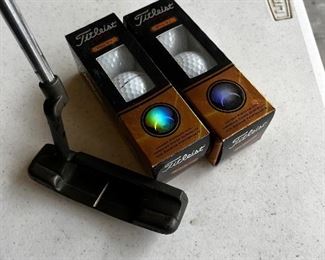 Brand new Titleist golf balls, assortment of clubs, Ping included!