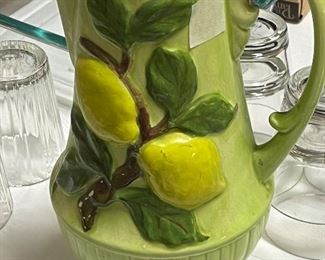 Beautiful pottery pitcher with lemons