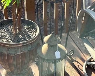 Lots of outdoor decor, lanterns, furniture, pots, vases, wheelbarrow, and yard art!