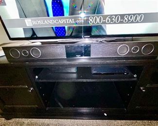 Close-up view of TV stand, sound bar is SOLD
