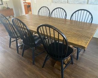 Farmhouse dining table purchased at Stickley, set of 8 black farmhouse chairs purchased at Ethan Allen. Will be sold separately 