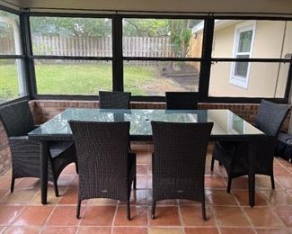 LIKE NEW Ratana dining table with glass top and 6 chairs