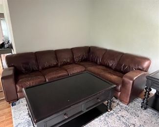 Brown L-shaped leather sectional sofa