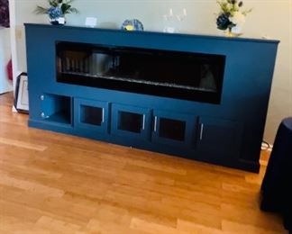 Electric fireplace cabinet. Unfortunately, it does not turn on so it's being offered as a display cabinet "as is". Not sure if it's repairable but for someone who's an expert electrician, this might be an easy fix. 