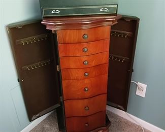 Jewelry cabinet six drawers and necklace storage on the sides