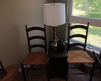 Two ladder back chairs with cane seats woven