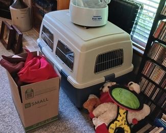 Large dog kennel and dog toys and drinking dog drinking fountain