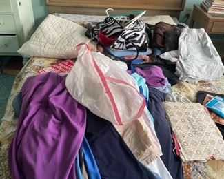 . . . vintage clothing on mid-century headboard