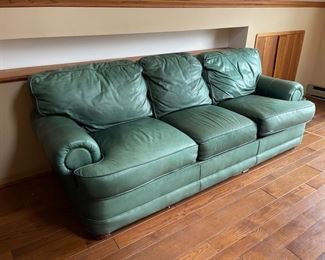 Green leather sleeper sofa. Ask a worker to see it.