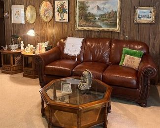 Couch, coffee table, paintings, decor, figurines, 
