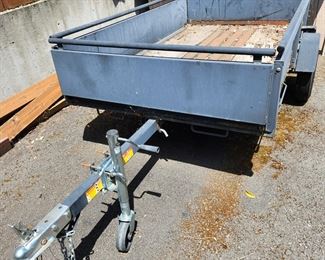 Snowbear Limited Trailer made in Canada. Tilt trailer, Capacity 1 Ton Weight Limit. Needs new floor. Tires are good. $2,500.