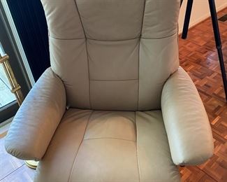 Stressless chair with motorized foot recliner action. 