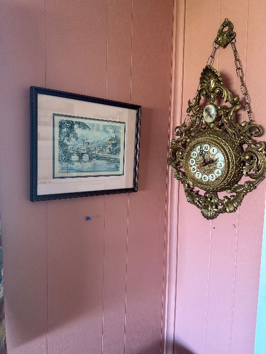 Victorian looking hanging clock and city scene