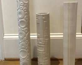 $150 USD     Set of 3 Decorative Tall Relief Cylinder Column Ceramic Vases HR177-32    Description:  These lovely relief shaped vases brings a touch of elegant sophistication to any household. Ideal placed by the window or on any end table.
Dimensions: 3 x 21"H; 3 x 19"H; 3 x 16"H
Condition: Very good
Local pick up NW Washington, D.C.  Contact us for shipper suggestions.     https://goodbyhello.com/products/decorative-columns-hr177-32?_pos=32&_sid=f3a74cf28&_ss=r