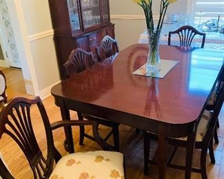 dining room set that includes six shield back chairs and two more  table leaves