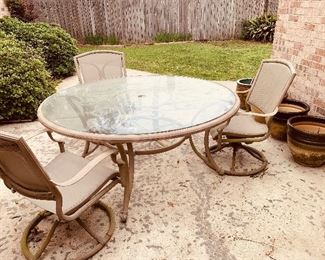 swivel patio set with table  and three  complete  chairs.  We  have  more  chairs  with the  mesh cloth inserts.  You will have to put them together
