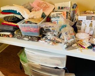 small sewing  supplies  including  bolts  of fabric