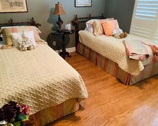 this is a set of antique style twin beds and notice the gorgeous bedding  with matching  drapes