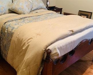 Bed is an antique three quarter bed with custom made mattress 