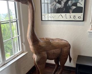 Who doesn't need a life-sized wooden llama?  Oh, and don't forget the Joan Miro art on the wall.