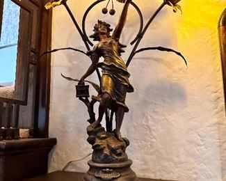 One of a pair, cast Art Noveau figural newel lamp.