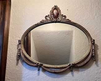Unusual antique horizontal oval mirror.