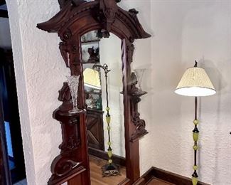 Dramatic carved antique hall mirror.