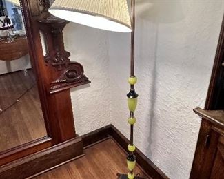 Bridge lamp, cast metal & yellow & black glass base.