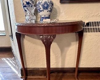 Pretty carved demilune table.