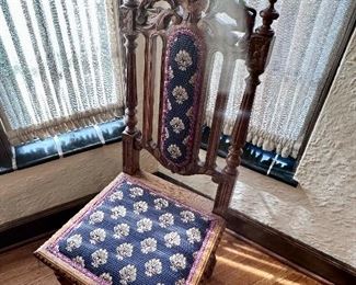 Jacobean side chair with carved lion detail.