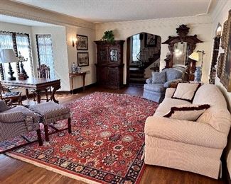 Living room full of custom upholstery & antiques.