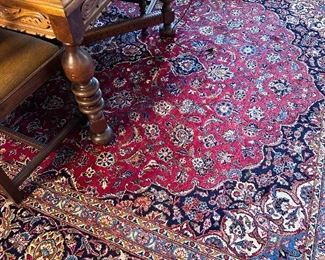 Wool traditional area rug in the dining room.