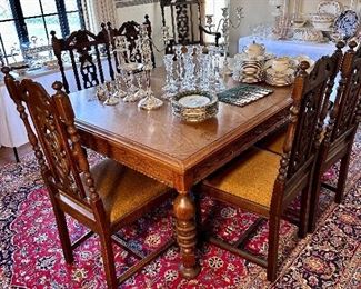 Beautiful dining room table with 4 leaves & 7 carved chairs.