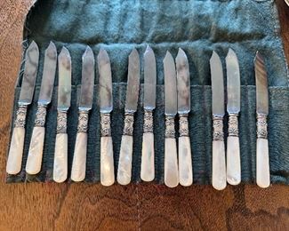 Set of 12, pearl handled fish knives.