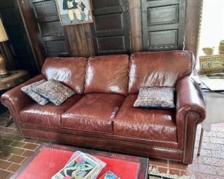 Great leather sofa with brass nailhead trim, purchased from Gormans.