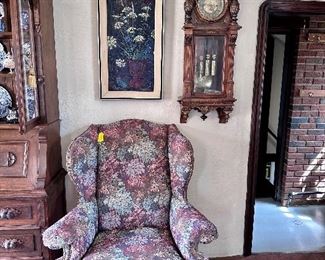 One of two floral custom floral wingback chairs.