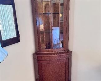 Corner glass front display cabinet.