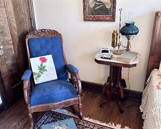 Carved upholstered rocker & needlework footstool.