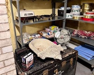 Black travel trunk with original shipping address.