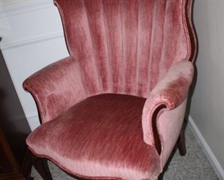 one of a pair of velvet armchairs