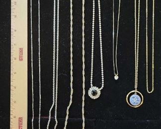 7 Assorted Necklaces in Varying Sizes and Materials