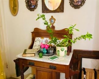 Marble top washstand with colorful backsplash tiles. Original and in excellent condition.