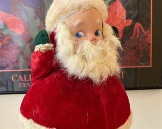 Wait, it gets scarier! This vintage Santa is a revolving music box