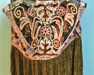 This dress is Mary McFadden Couture.......Other designers include Ralph Lauren, Armani, Valentino, Luca Luca....The list goes on!