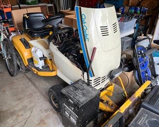 CUB CADET TRACTOR WITH PUSH BLADE AND MOWER DECK. NEEDS BATTERY.