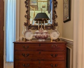 Wonderful 4-drawer antique mahogany chest, vintage brass bouillotte table lamp, vintage wall mirror, antique 2-piece English transfer tureen (Copeland's Stoke-Upon-Trent) pair of antique English porcelain bowls on stands and pair of vintage lobed glass brass candleholders.